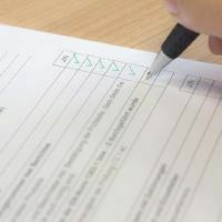 A pen ticking a checklist