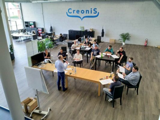 Photo de l'équipe de Creonis dans leurs bureaux