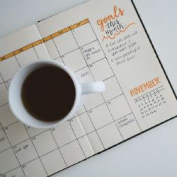 Month planner with cup of coffee